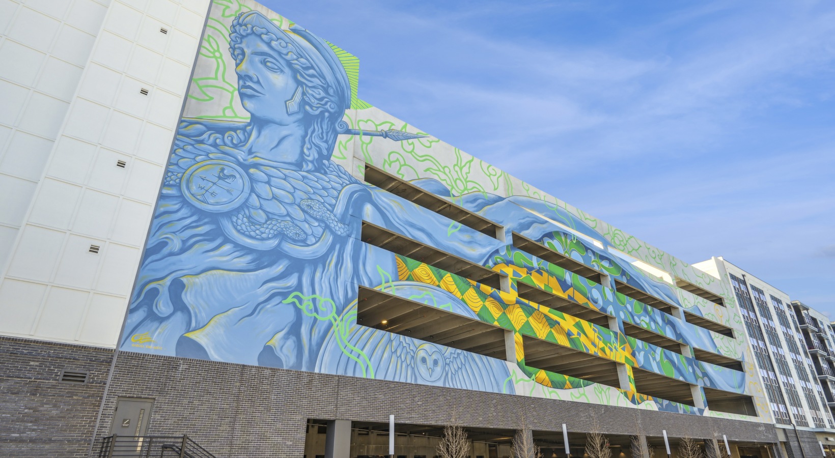 An apartment building with stores on the ground floor.