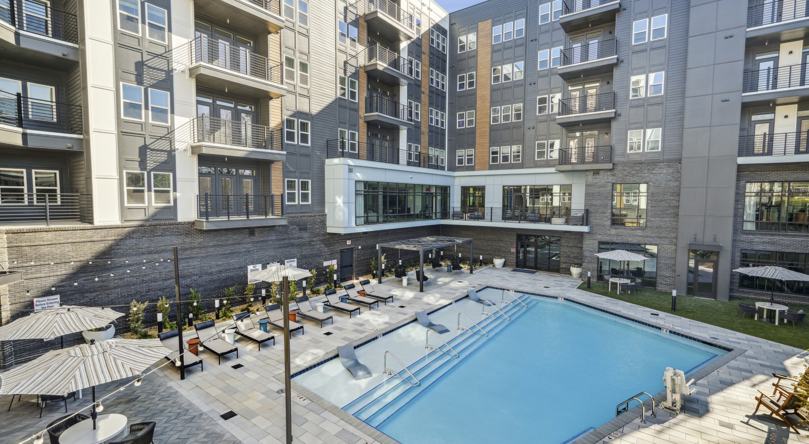 A room with multiple bike racks and bikes.