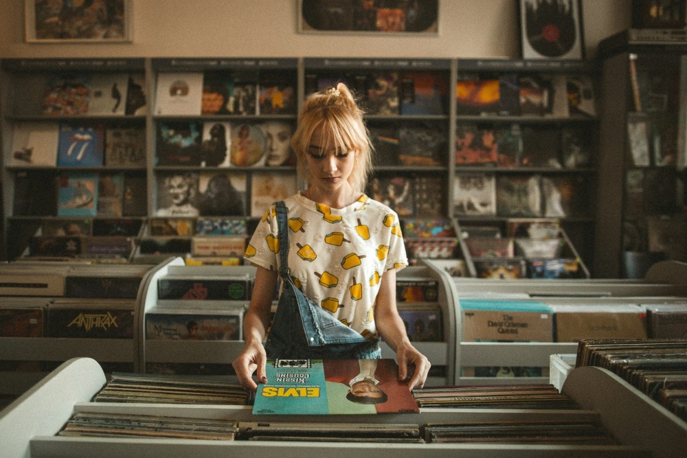 Woman shopping in a record shop.